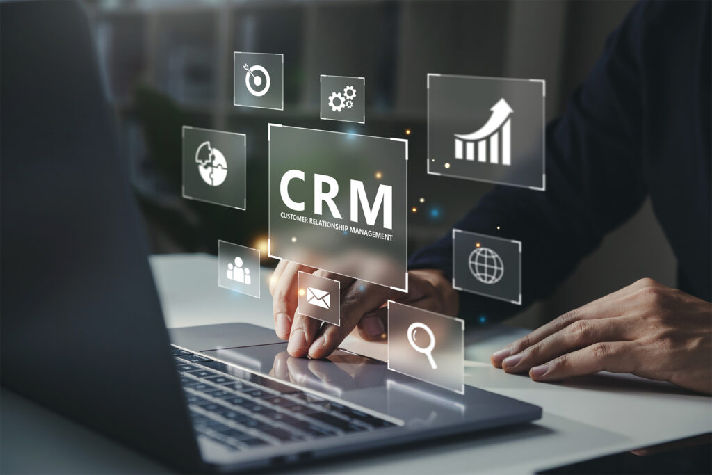 a close up of a business leader looking up how to choose a crm system on their laptop